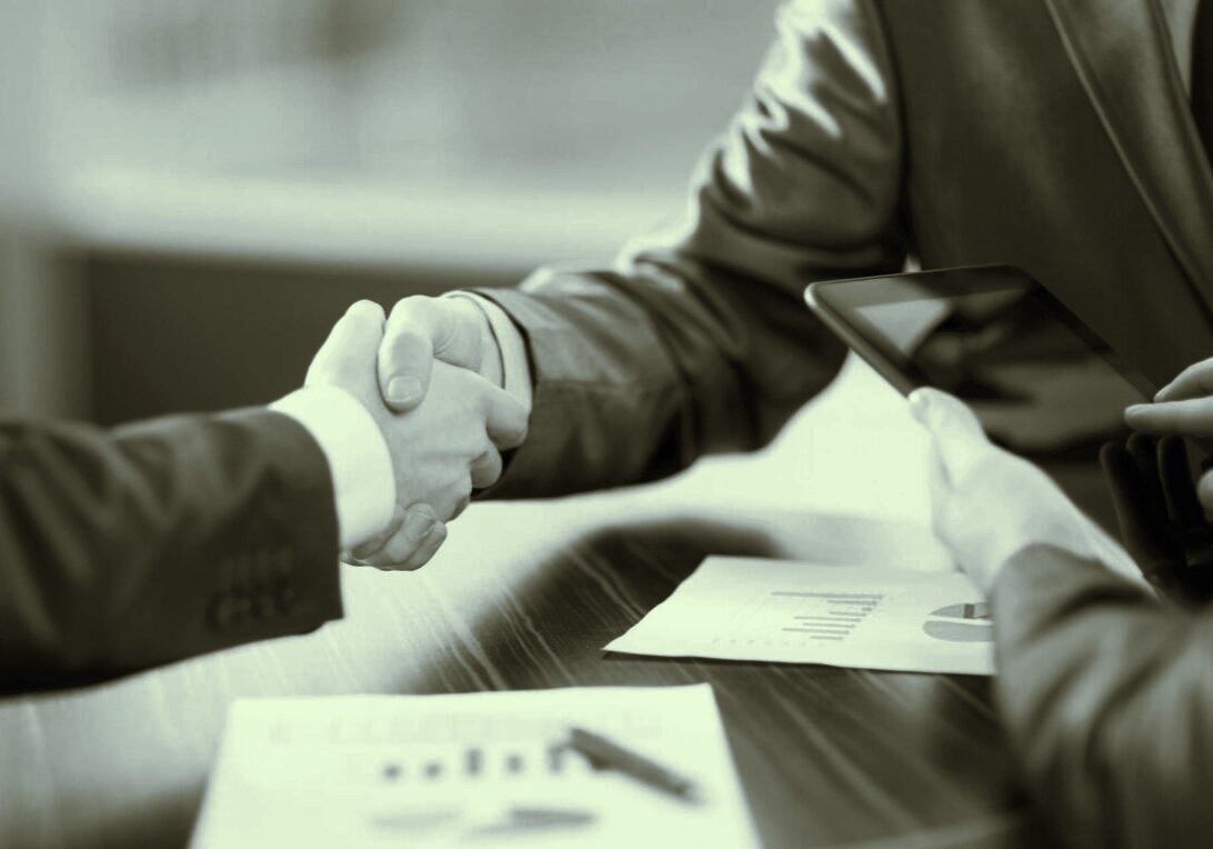 Business people shaking hands in office